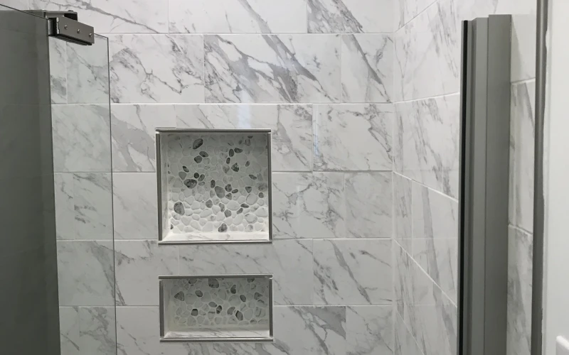 A newly installed bathroom sink and faucet set in a Mountainbrook home, showing clean supply line connections and a finished vanity countertop. The surrounding wall and cabinet show no water damage, reflecting a properly completed fixture installation.